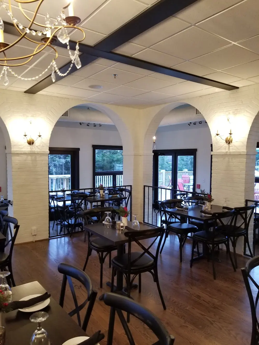 White brick arches and dark tables in the dining room at Appalachia Kitchen