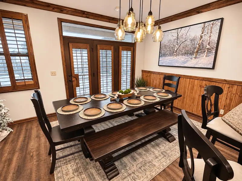 Long dining table at Black Bear 32 with bench seating, set for a group