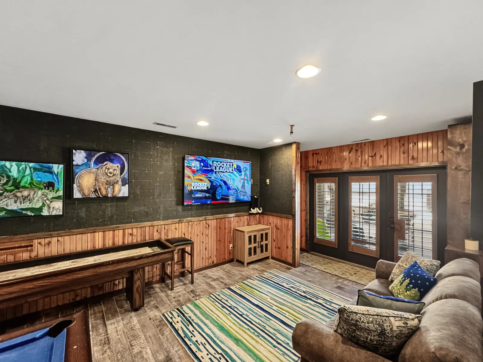 Game room at Black Bear 32 with TVs and a pool table