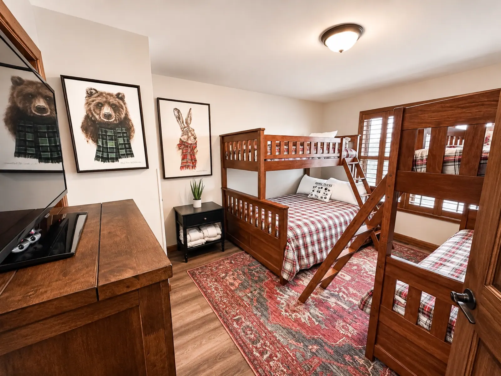 Bunk room at Black Bear 32 with plaid bedding