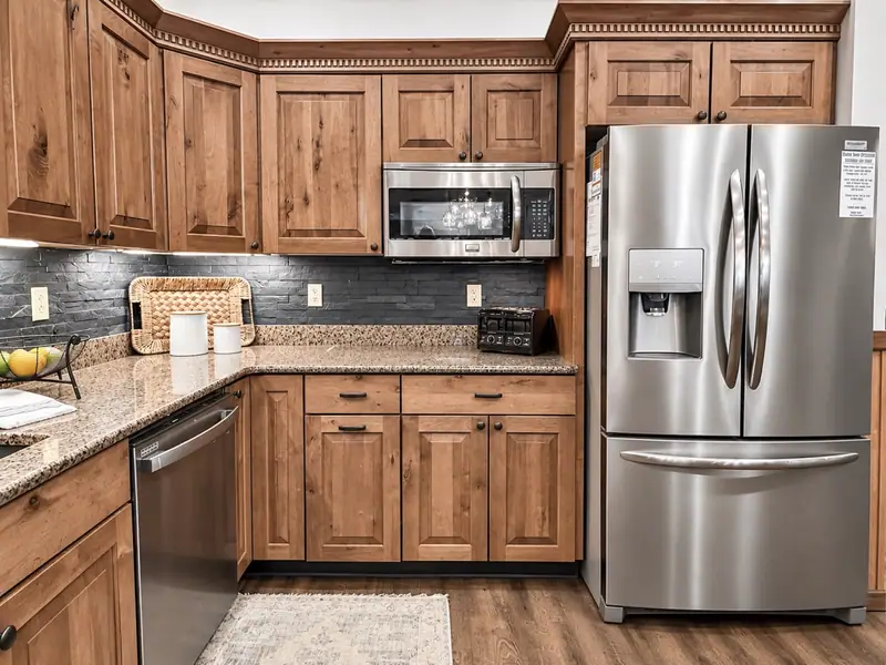 Stainless fridge, range and microwave in the Black Bear 32 kitchen