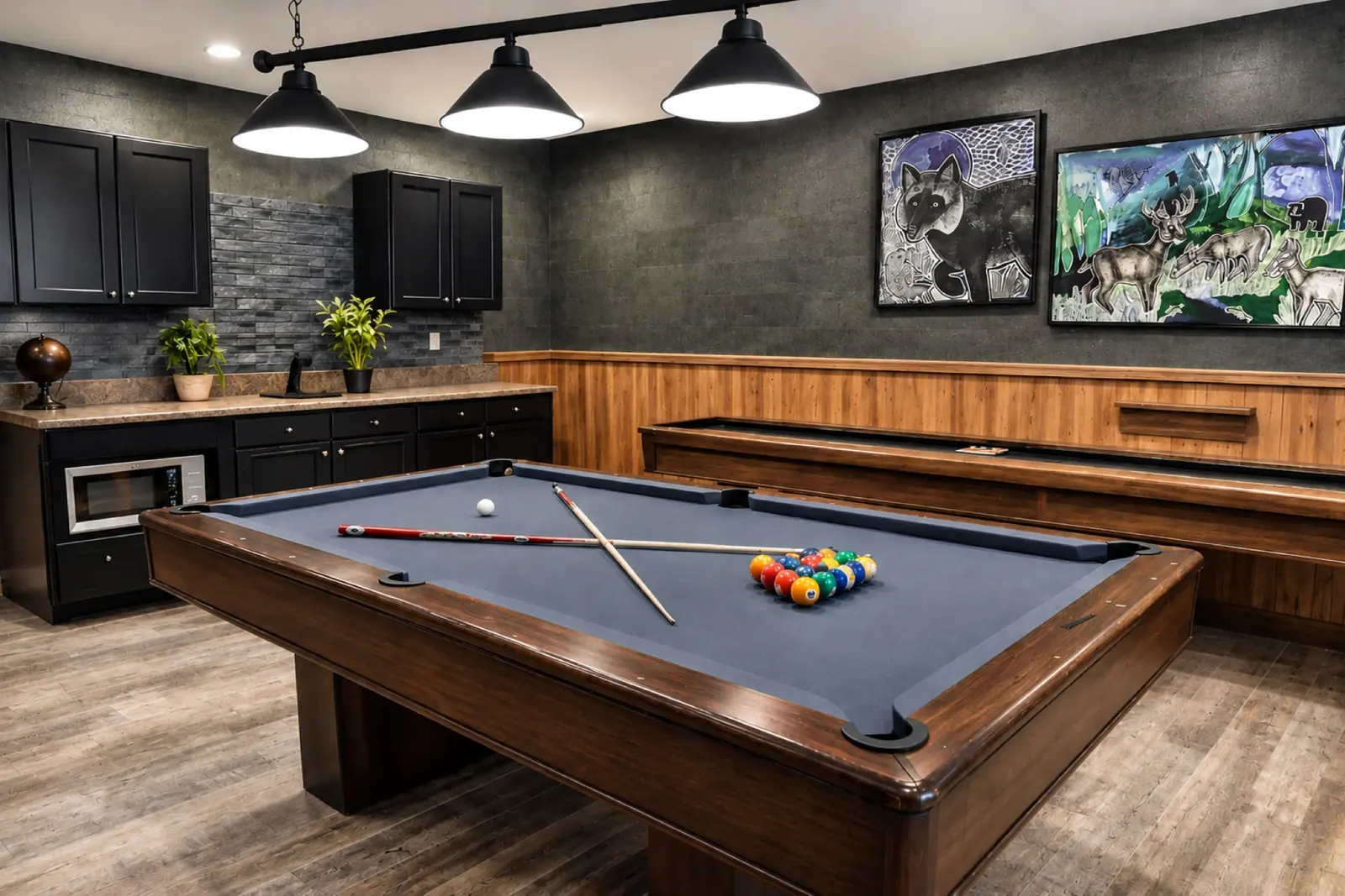 Pool table in the Black Bear 32 game room, with the wet bar and shuffleboard behind