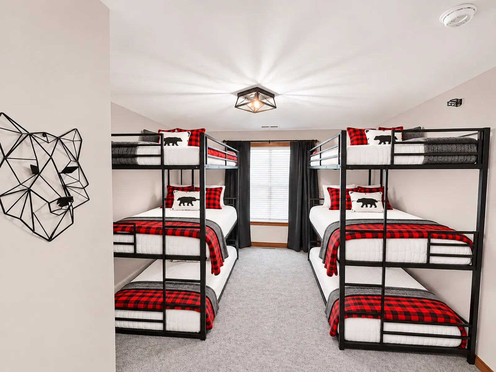 Bunk room at Black Bear 33 with red plaid bedding