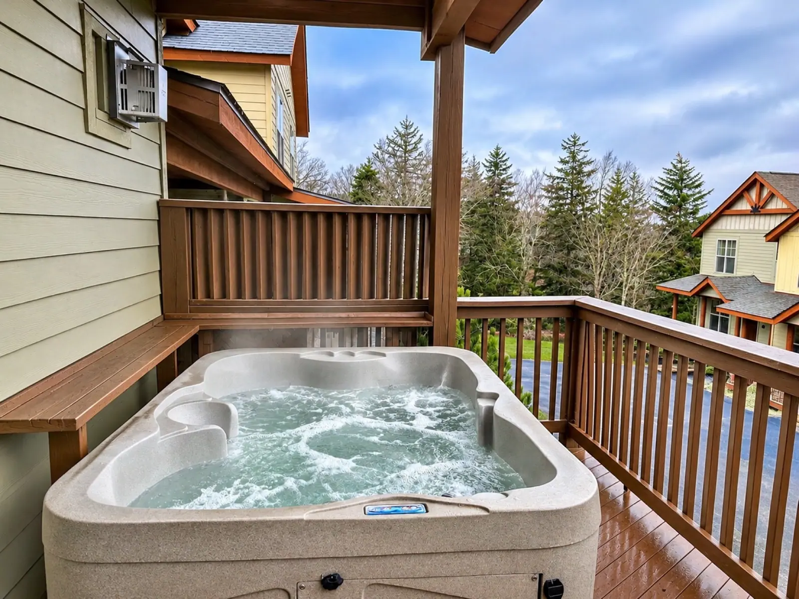 Private hot tub on the covered deck at Black Bear 33