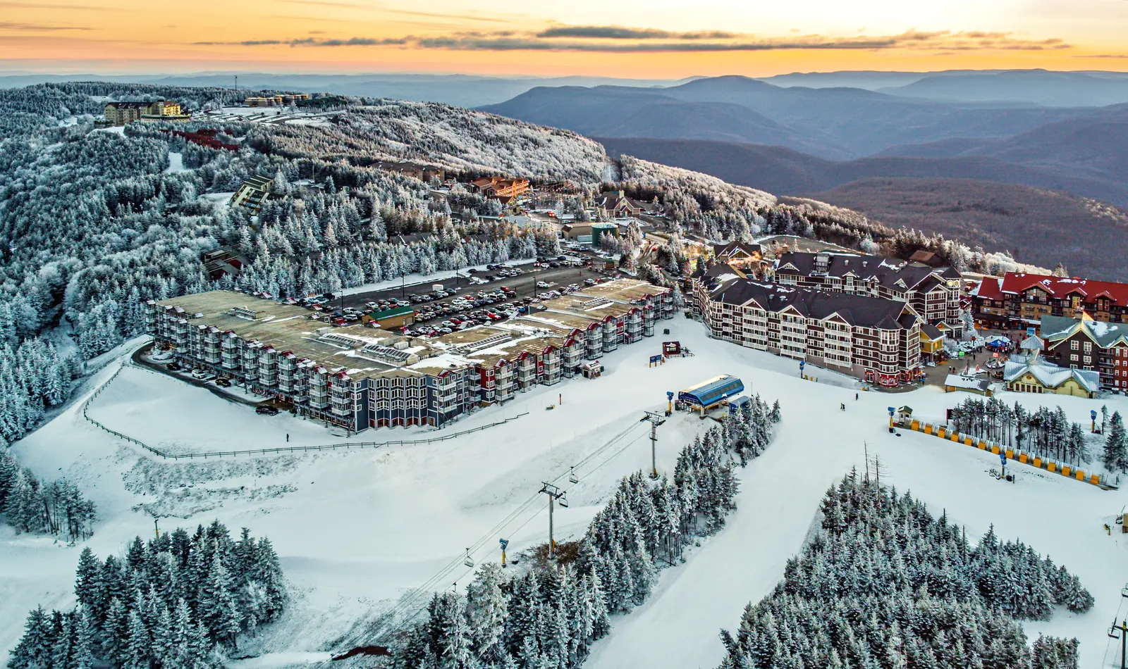 Aerial view at sunset of Mountain Lodge and the Snowshoe Village