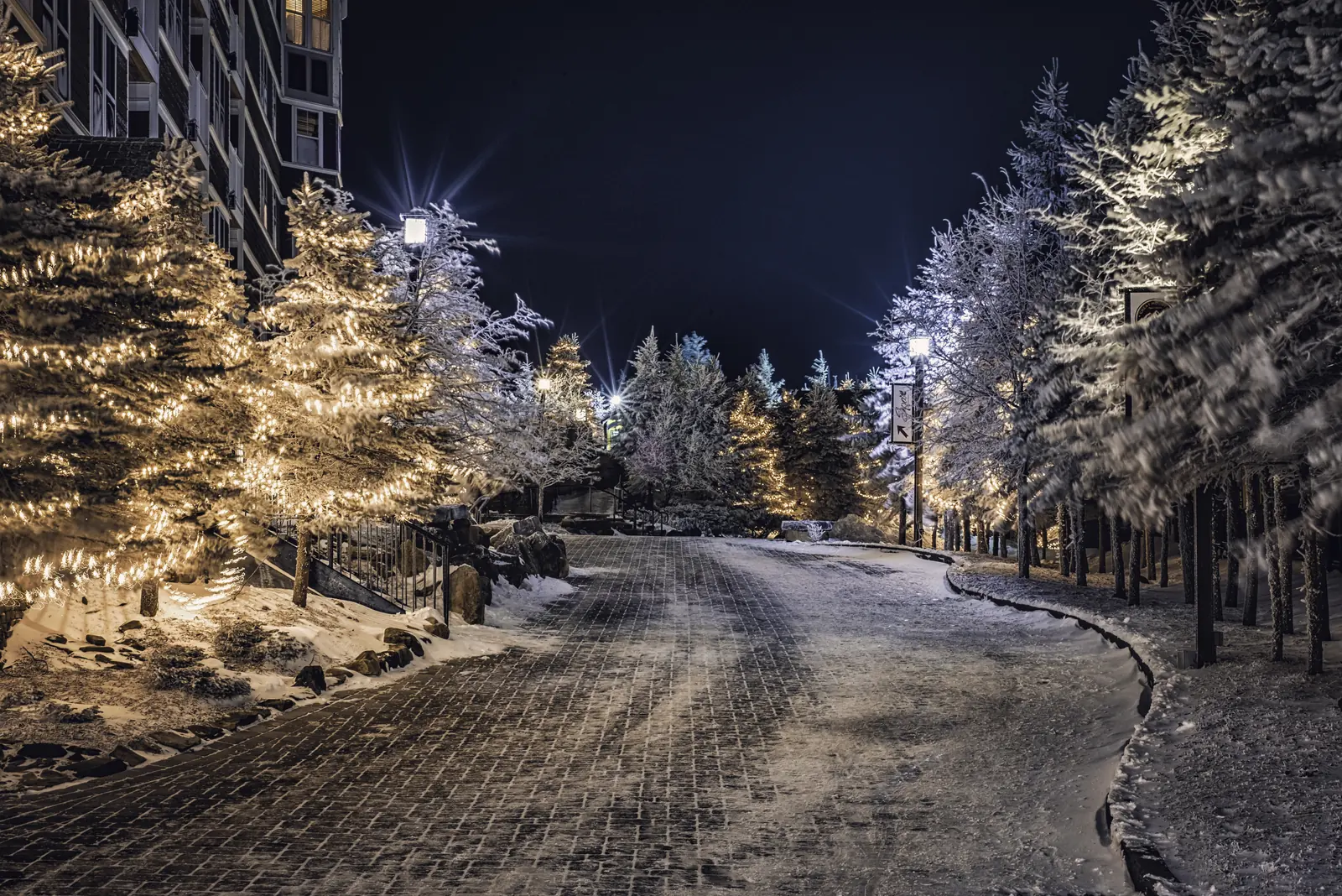 The Snowshoe Village lit up on a snowy winter night