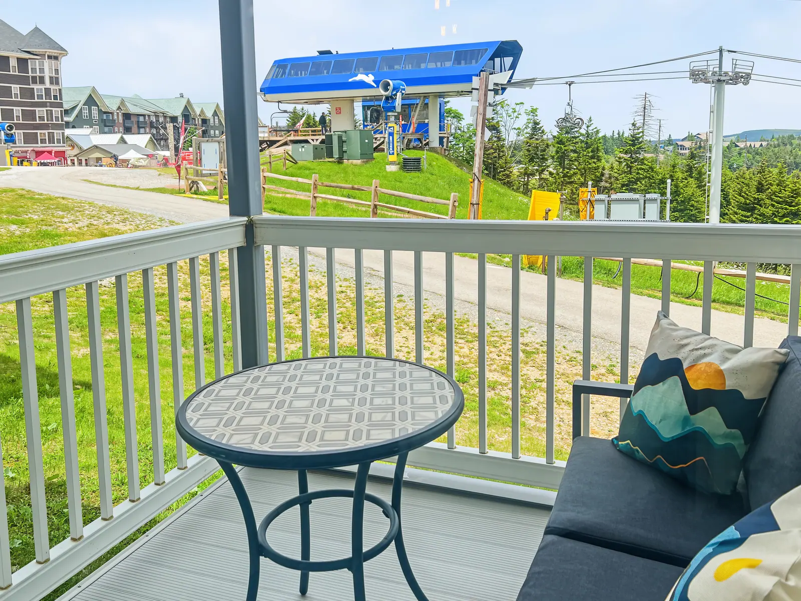 Private deck at Mountain Lodge 140 looking at the Ballhooter lift in summer