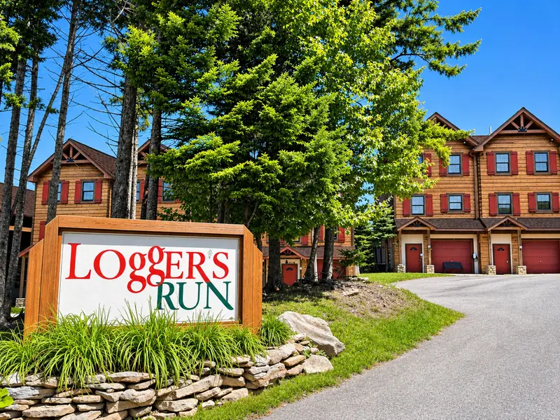 The Loggers Run sign at the community entrance