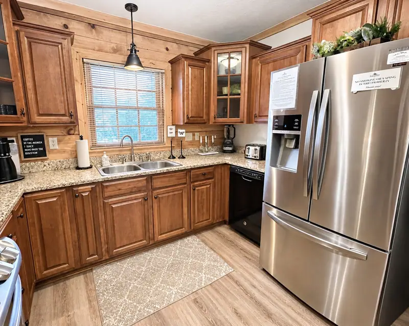 Kitchen at Loggers Run 12 with a stainless French-door fridge and a window over the sink