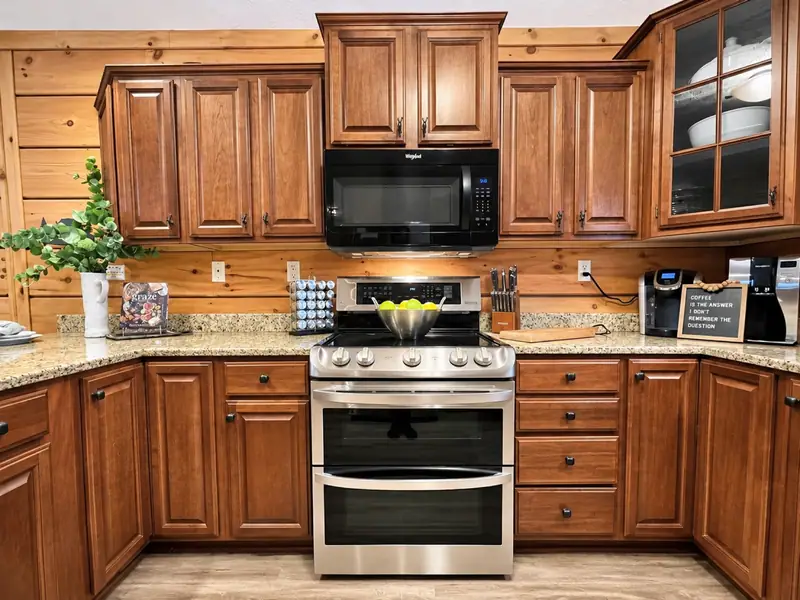 Double-oven range and cherry cabinets in the Loggers Run 12 kitchen