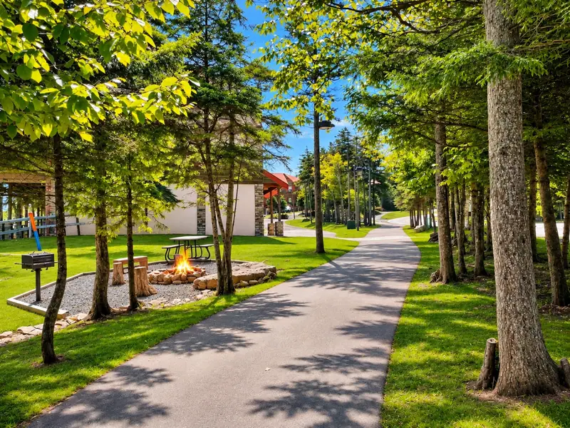 The walking path toward the Village beside the Loggers Run fire pit