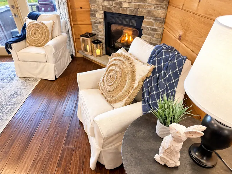 Armchairs by the gas fireplace at Loggers Run 16