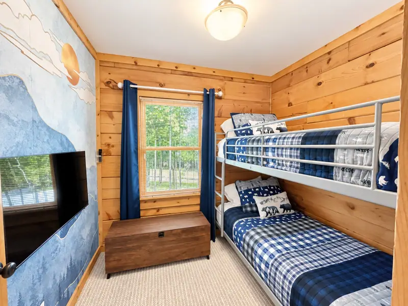 Bunk room off the kitchen at Loggers Run 16 with blue plaid bedding