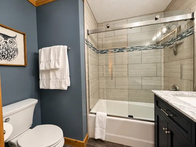 Hall bathroom at Loggers Run 16 with a tub and shower