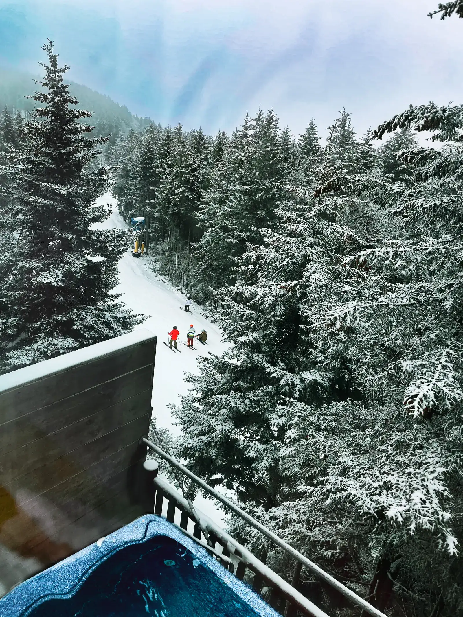 View from the Loggers Run 16 deck down to skiers on Flume