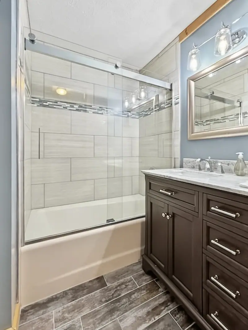 Top-floor bathroom at Loggers Run 16 with a new shower and tub combo