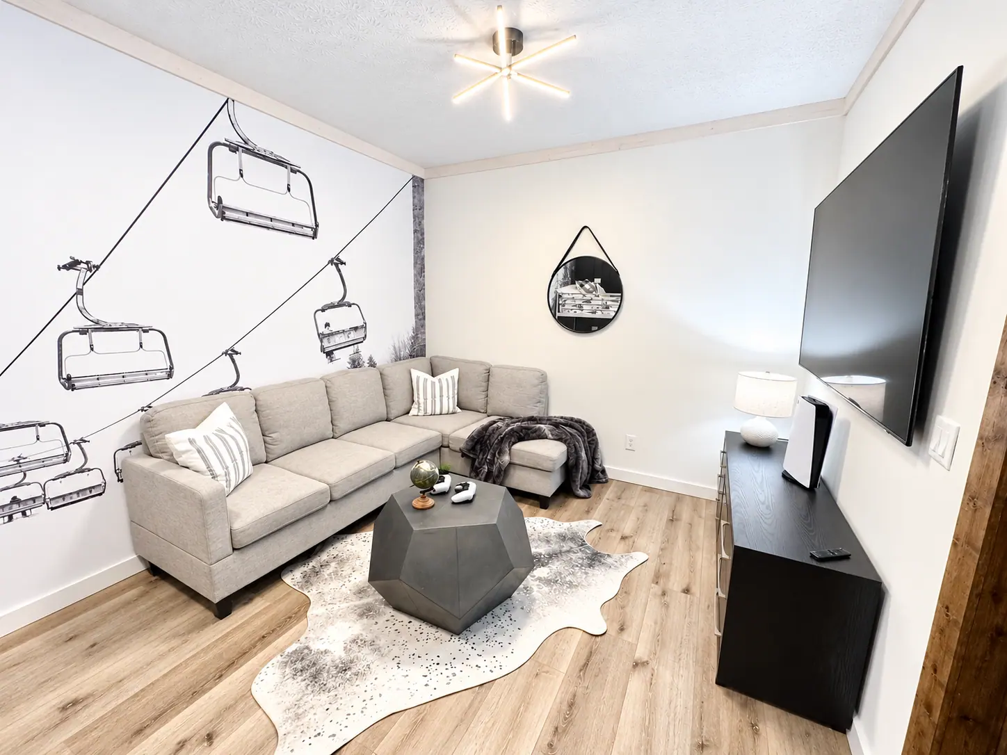 Rec room at Loggers Run 4 with a sofa and TV