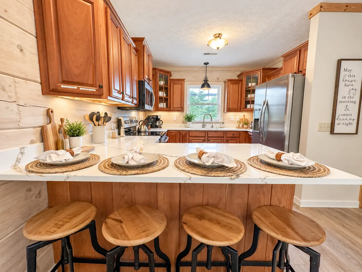 Kitchen island at Loggers Run 4 with bar stools