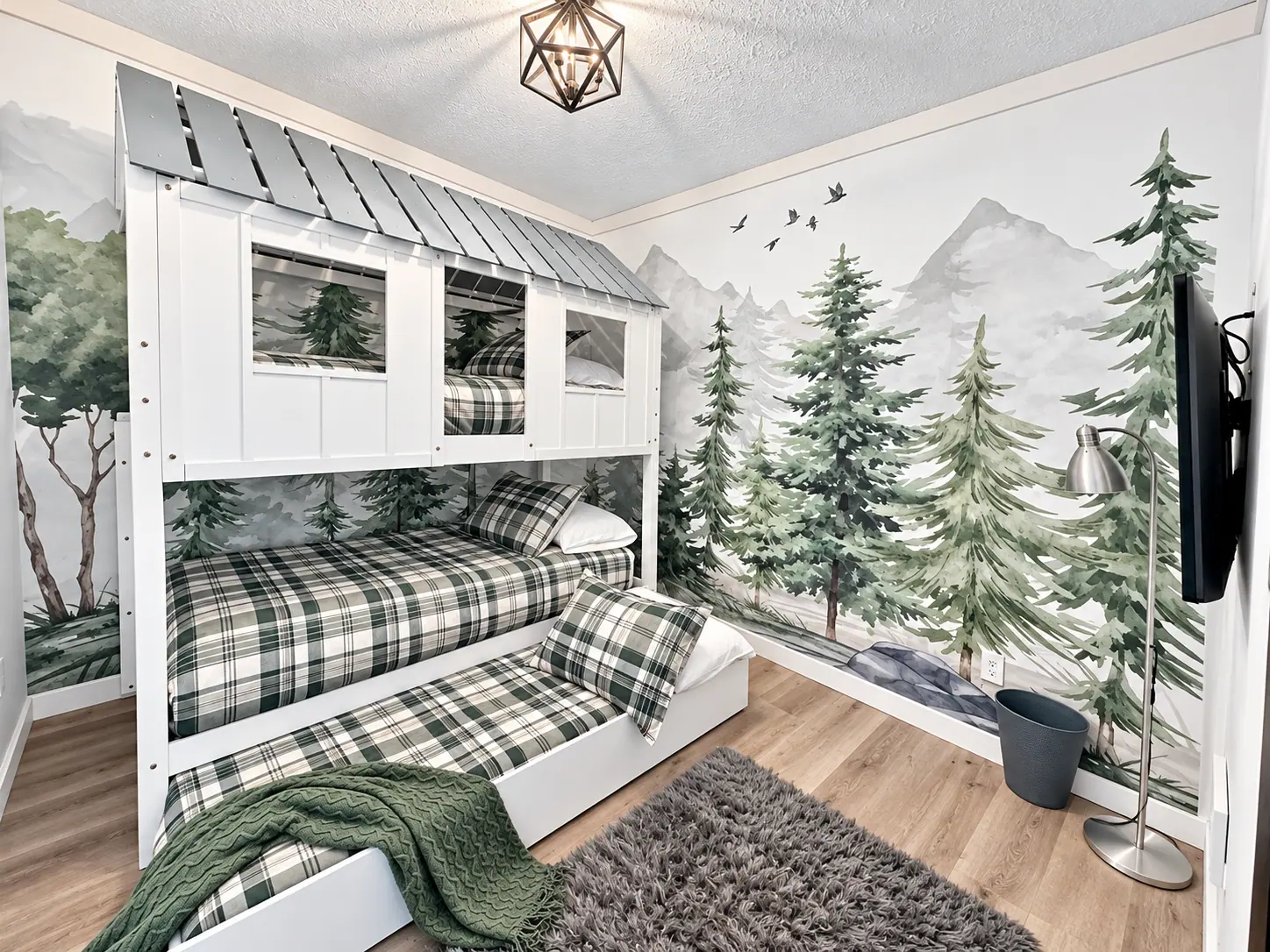 Bunk room at Loggers Run 4 with a painted forest mural