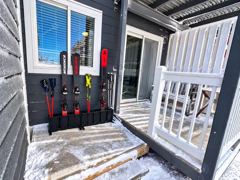 Ski rack with skis on the Mountain Lodge 114 patio