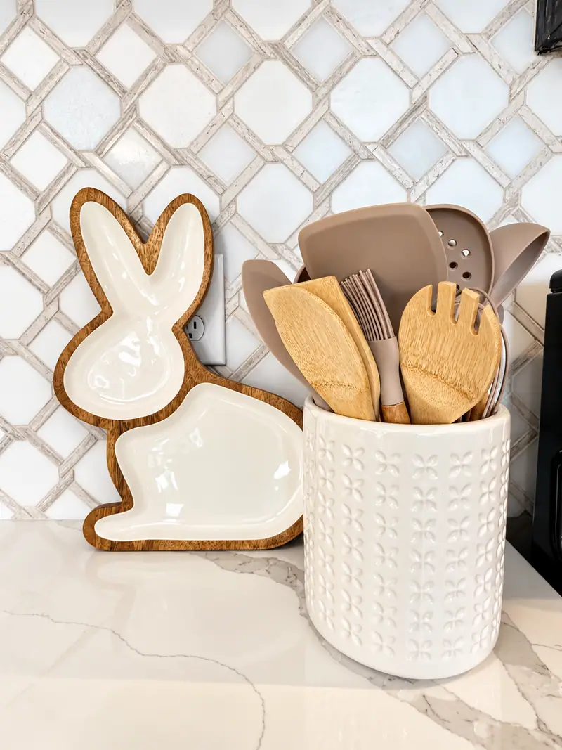 Wooden utensils and a bunny cutting board on the Mountain Lodge 114 counter
