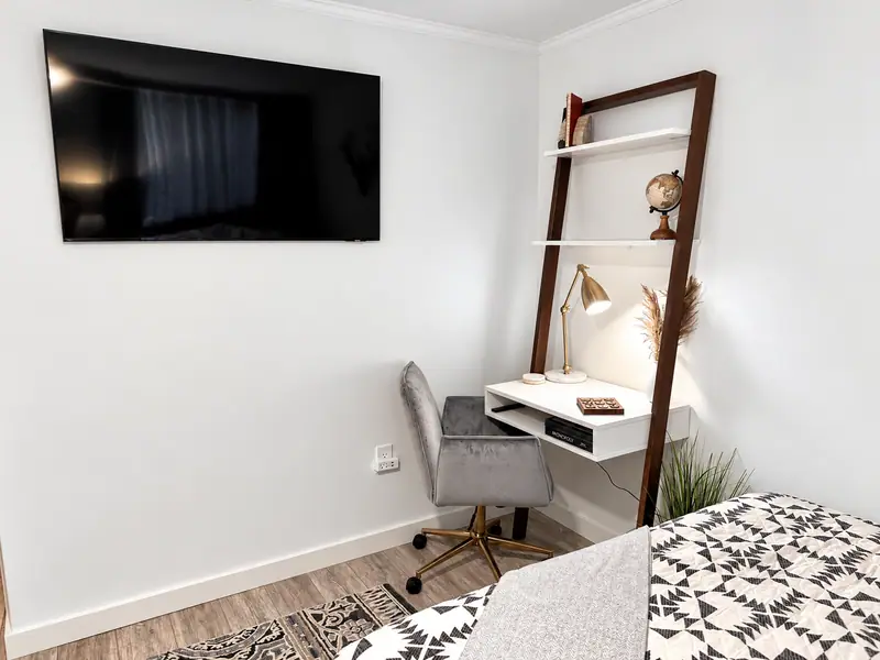 Desk and wall TV at Mountain Lodge 114