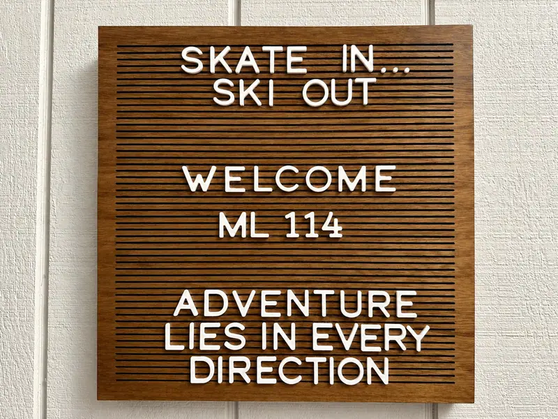 Letter board at Mountain Lodge 114: Skate in, ski out. Welcome ML 114