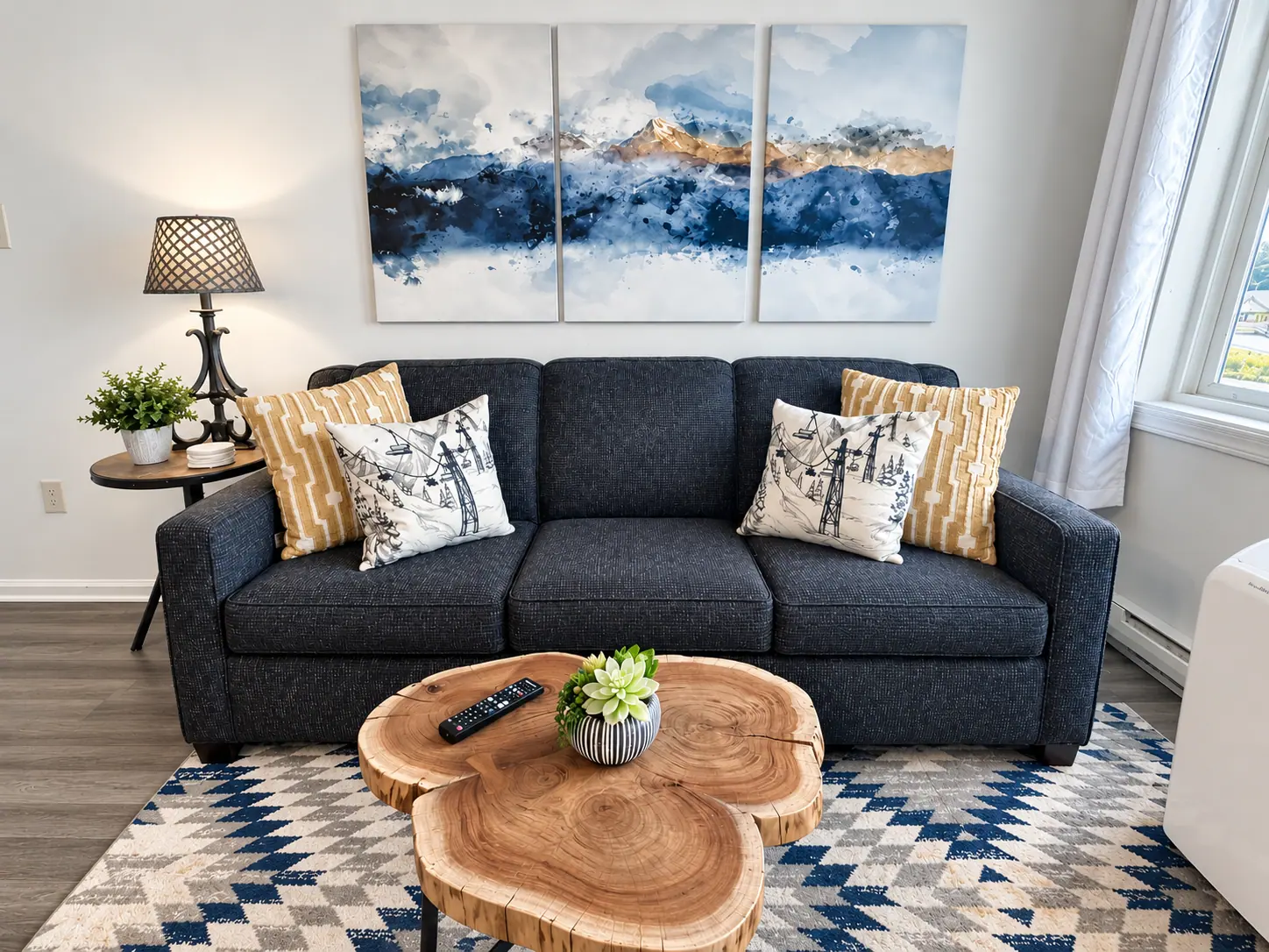 Living room at Mountain Lodge 140 with a gray sofa and mountain art