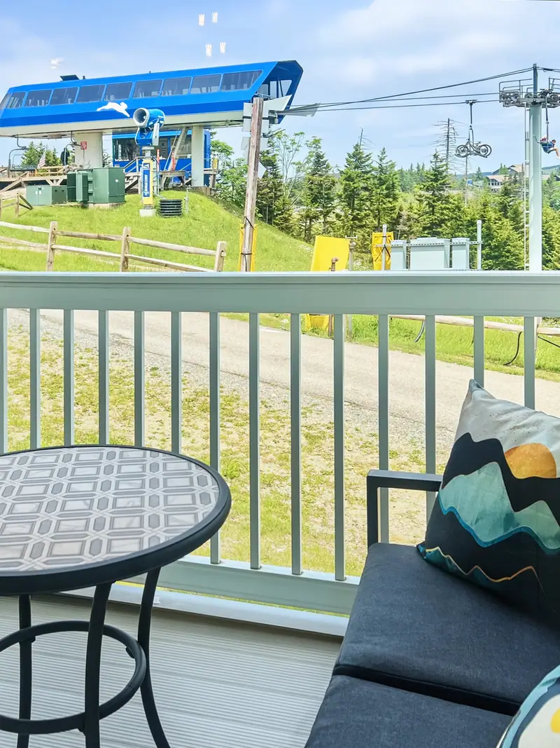 Deck at Mountain Lodge 140 with a view of the Ballhooter lift in summer