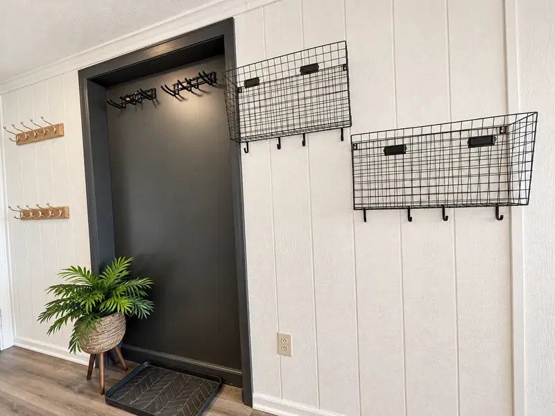 Entry at Mountain Lodge 140 with wall hooks and wire baskets