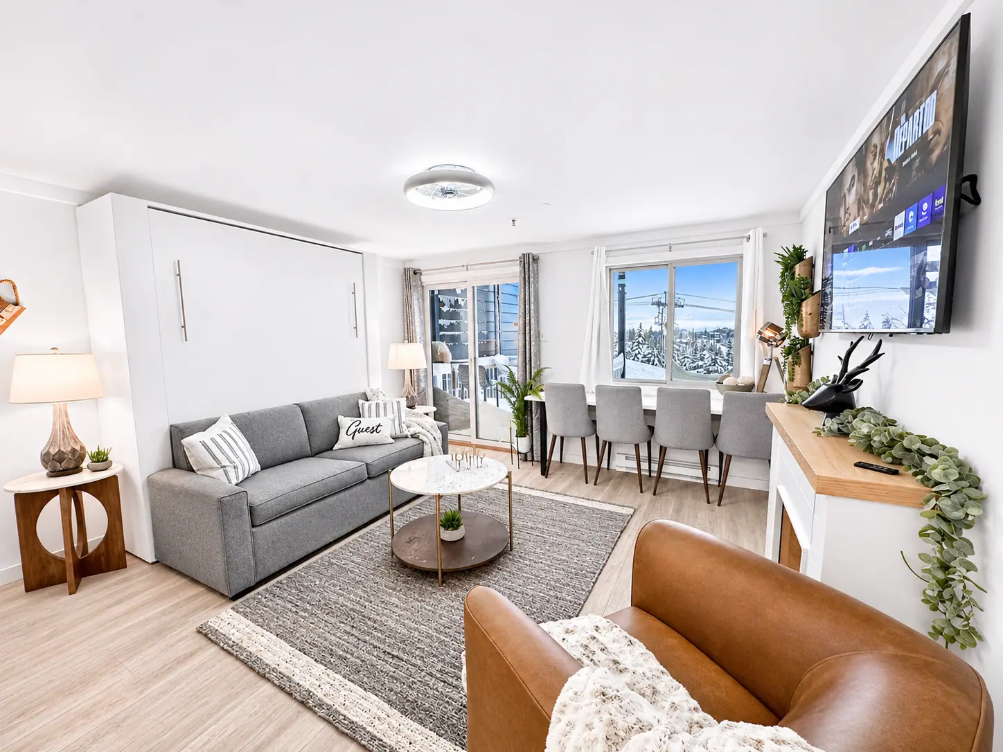 Living room at Mountain Lodge 144 with a sofa and slope-view windows
