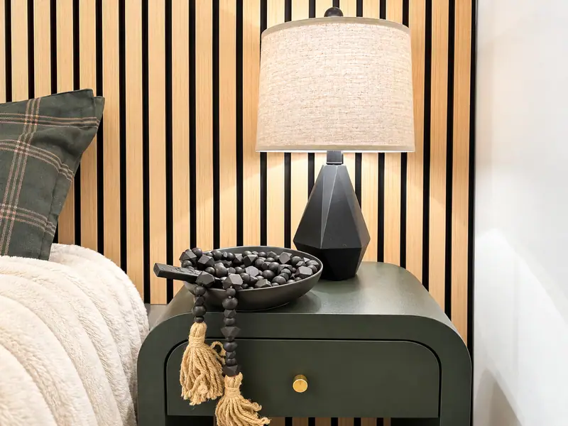 Green nightstand and lamp in the Mountain Lodge 144 bedroom