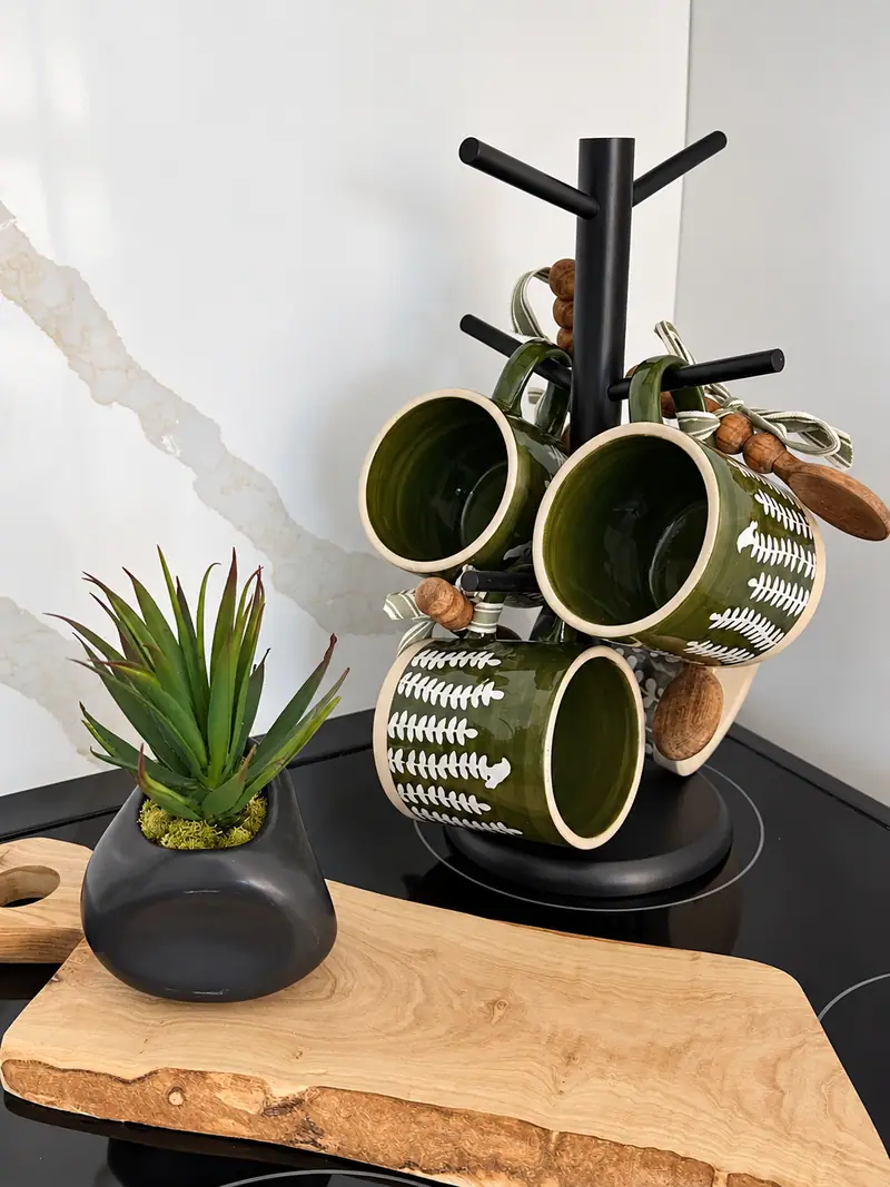 Mug tree and plant on a live-edge board at Mountain Lodge 144