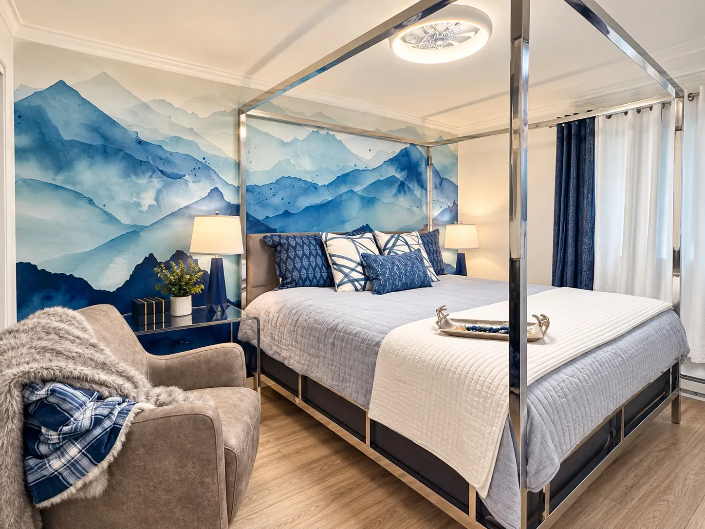 Primary bedroom at Mountain Lodge 146 with a canopy bed and mountain mural