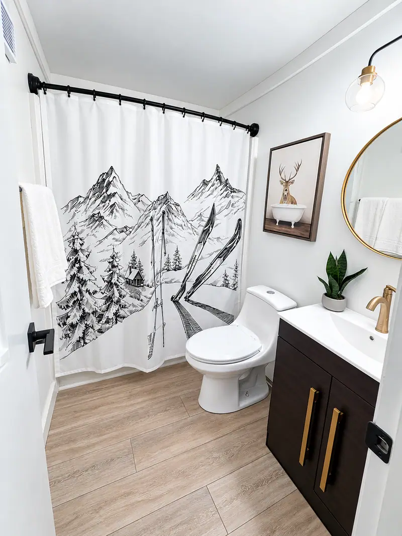 Bathroom at Mountain Lodge 146 with a black vanity and mountain shower curtain