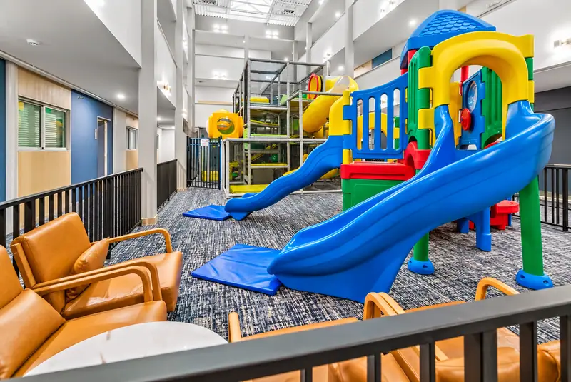 The indoor Adventure Playground at Mountain Lodge with slides and leather seating