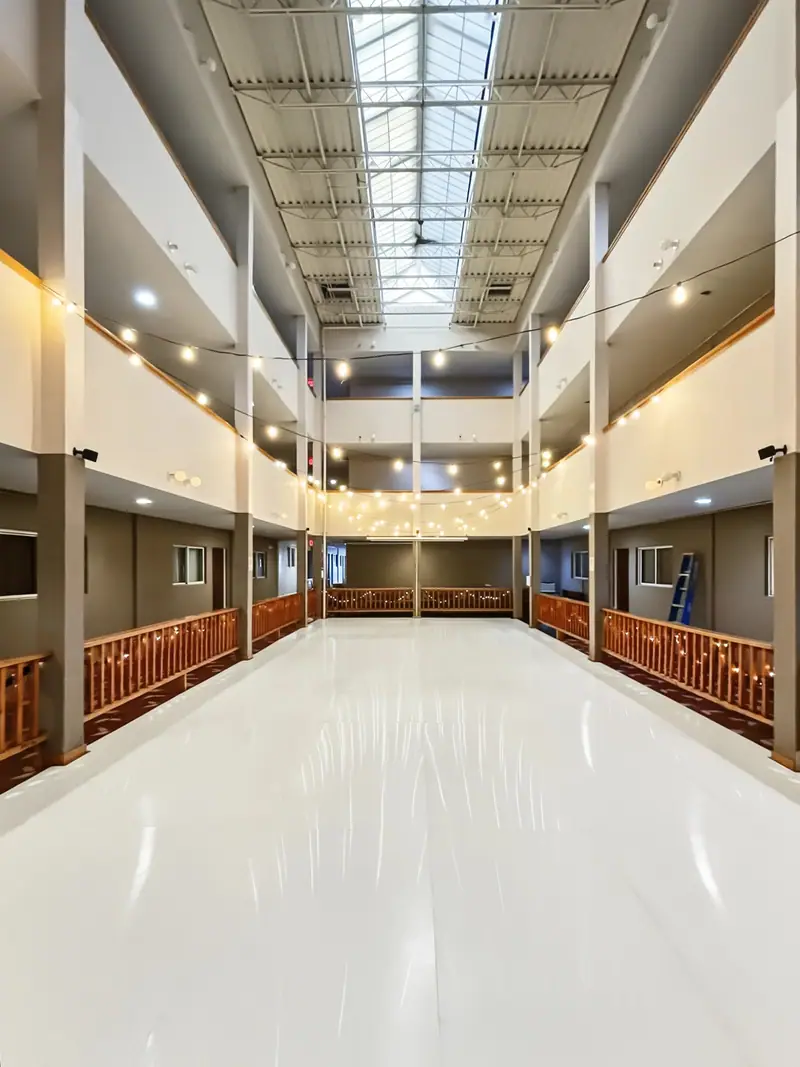 Synthetic ice rink in the Mountain Lodge atrium under the skylights