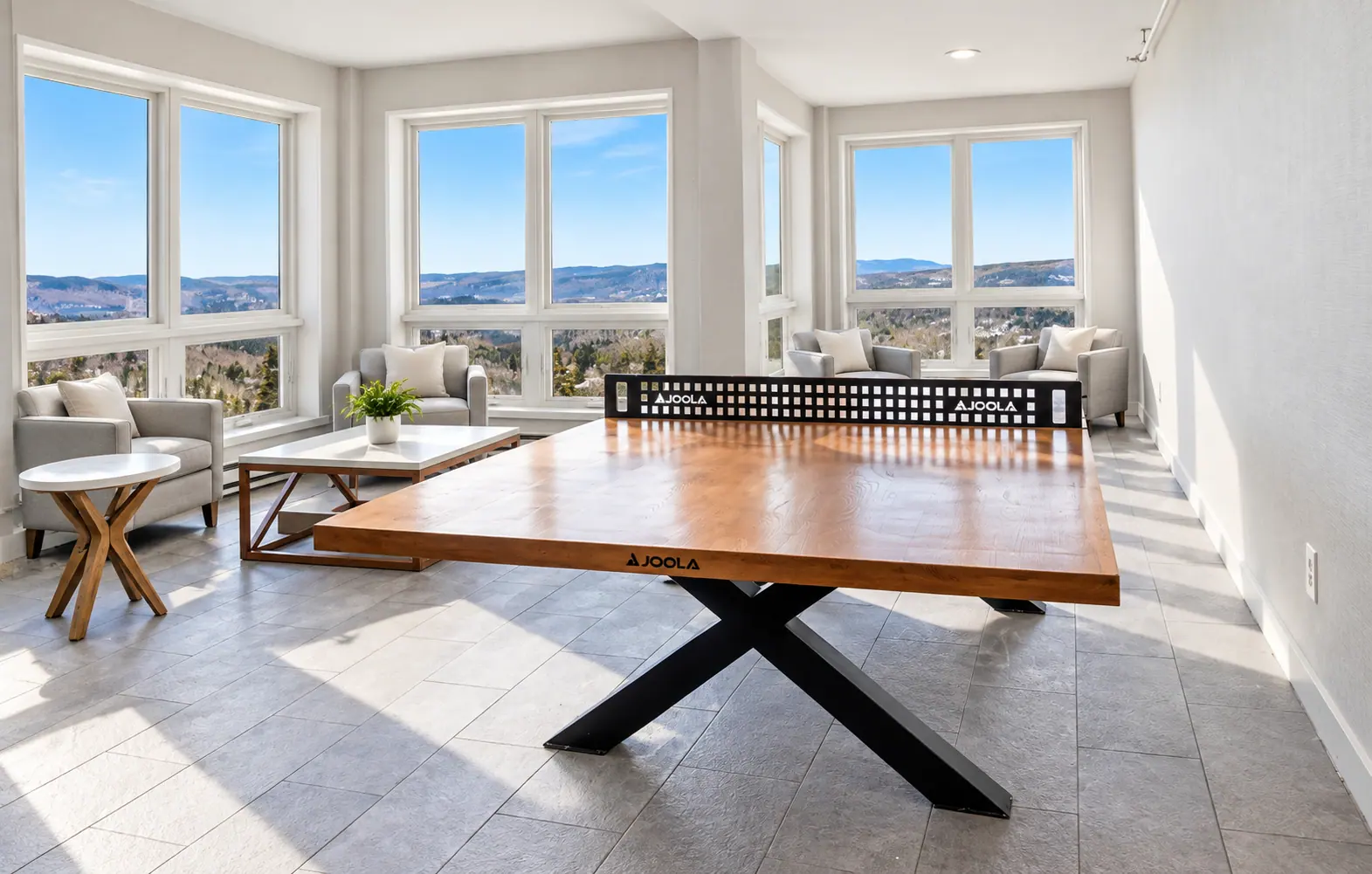 Ping pong table at Mountain Lodge with mountain-view windows