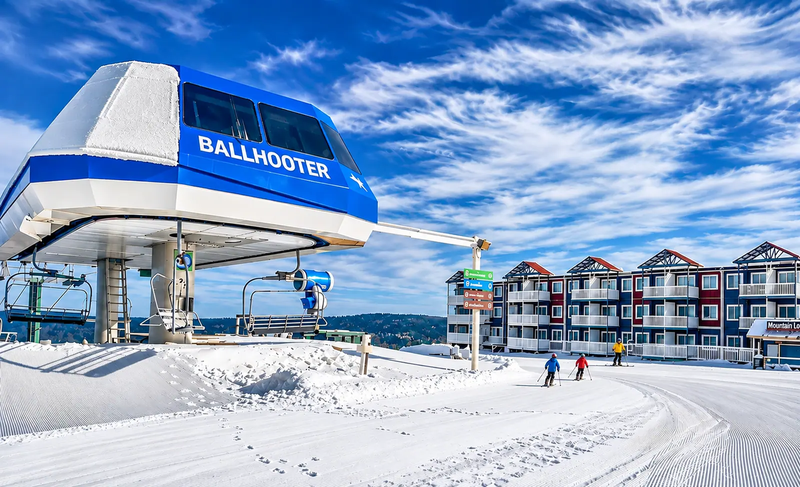 The Ballhooter lift with skiers and Village buildings behind