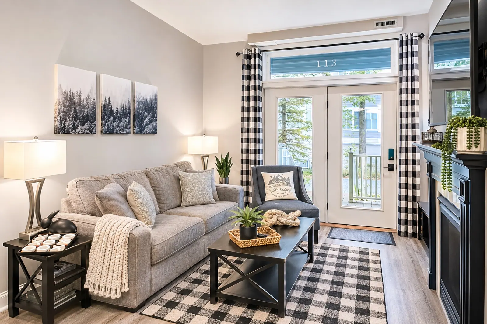 Living room at Seneca 113 with gray sofas and a plaid rug