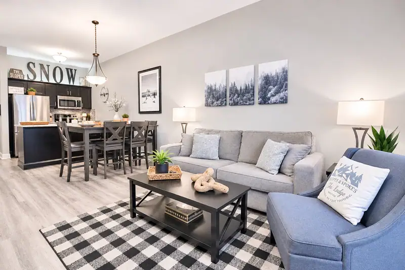 Living and dining area at Seneca 113 with the SNOW sign over the kitchen