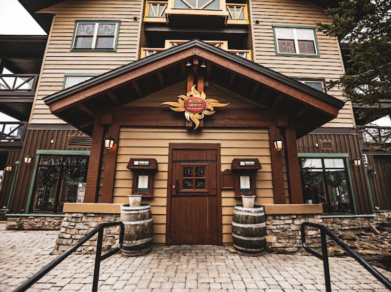 The Foxfire Grille entrance in the Snowshoe Village, with its sun-shaped sign