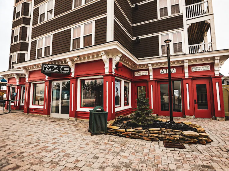 The red Mountain Adventure Center building in the Snowshoe Village