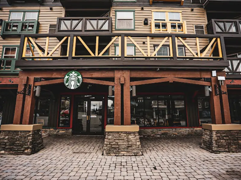 The Starbucks in the Snowshoe Village, under a timber balcony